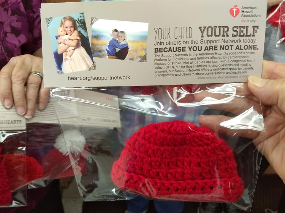 Shawls of Love Volunteers Hard at Work Knitting Red Caps for Babies Born in February in Honor of American Heart Month