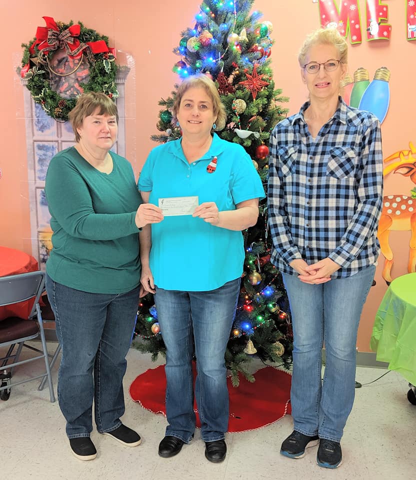 Lone Star Heritage Quilt Guild Makes Large Donation to Meal-a-Day Program