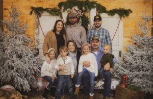  (Kolby, standing right, with his sister-in-law, Samantha Denney, brother, Cole Denney, nieces, nephews, Mom, Gereta Brown and Dad, Randy Brown)